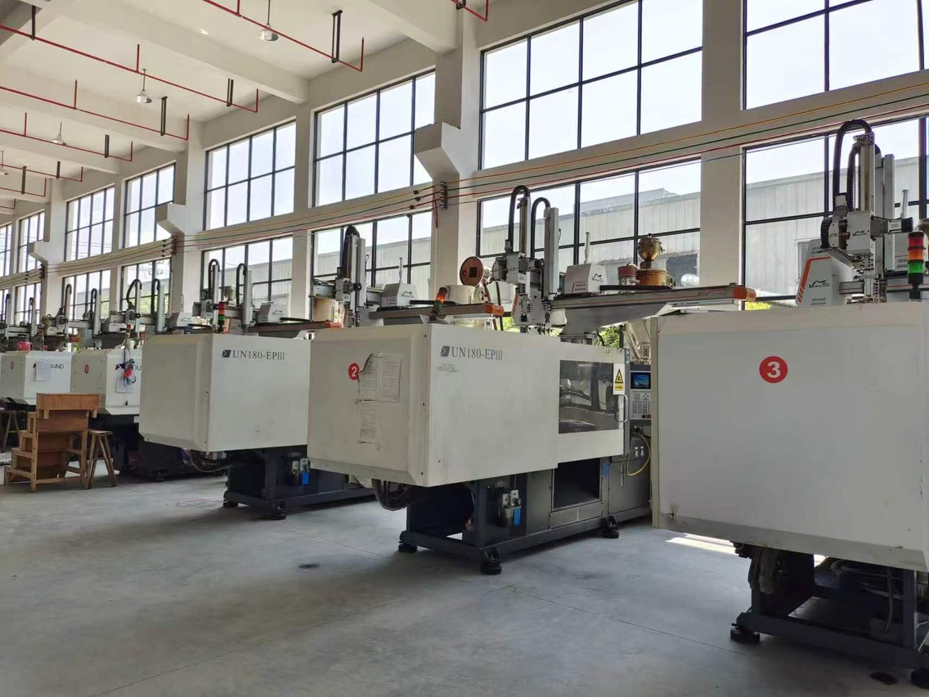 Injection molding machines in workshop